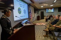 U.S. Army Lt. Col. Tiffany Dills gives a speech during her promotion ceremony at Joint Task Force Civil Support headquarters. The promotion was presided over by U.S. Navy Capt. Bryan Cochran, and attended by her family, including her husband U.S. Army Lt. Col. John Dills, who is currently deployed and was able to attend via video teleconference. (Official DoD photo by Mass Communication Specialist 3rd Class Michael Redd/RELEASED)