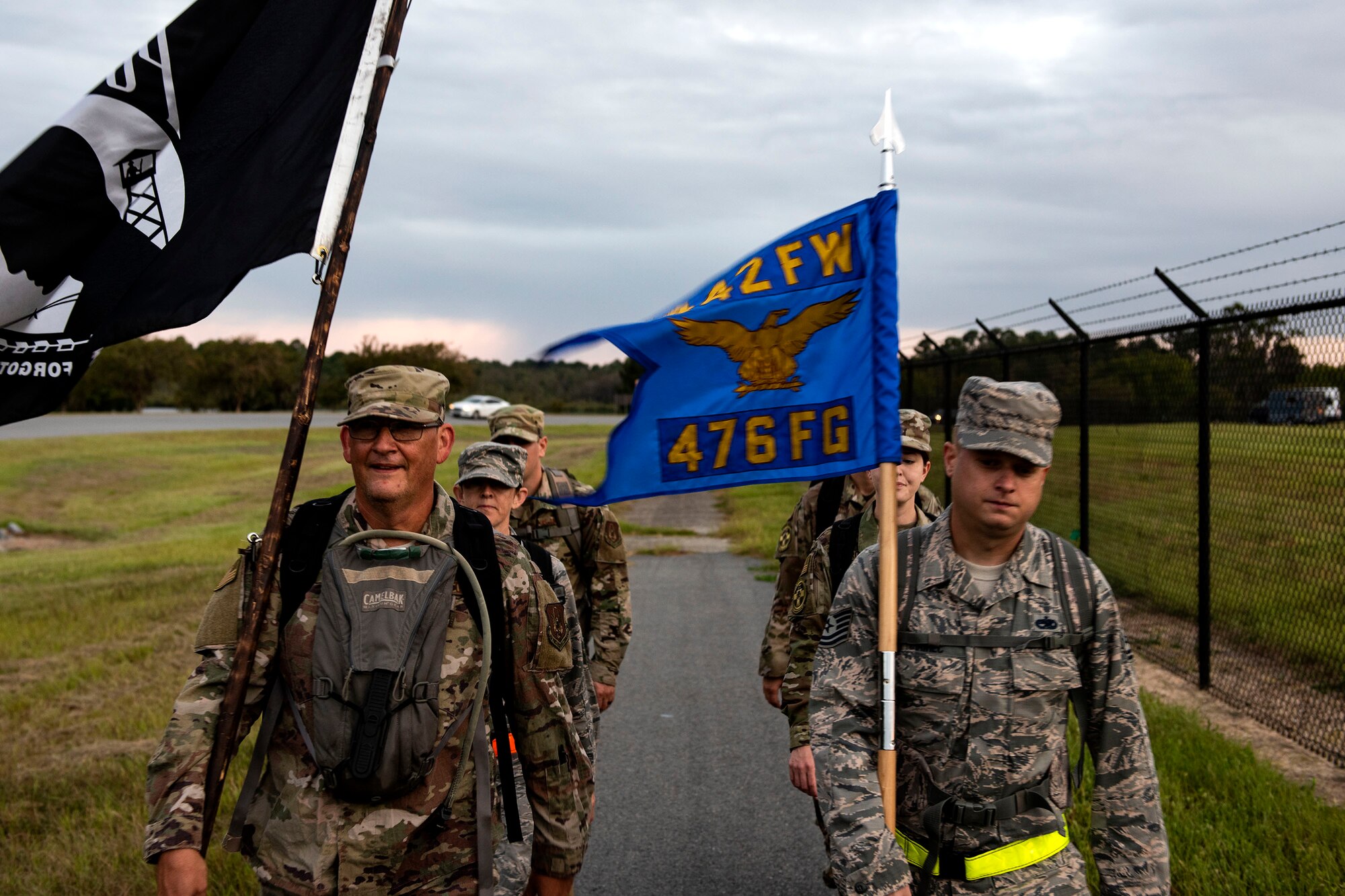 Airmen from the 476th Fighter Group participate in the POW/MIA Recognition Day ruck march Sept. 20, 2019, at Moody Air Force Base, Ga. In 1979, the United States Congress passed a resolution authorizing National POW/MIA Recognition Day to be observed together with the national effort of bringing isolated personnel home. The 347th Operations Support Squadron hosted the 24-hour ruck march to pay tribute to those who’ve been captured or missing in the line of duty. (U.S. Air Force photo by Senior Airman Erick Requadt)