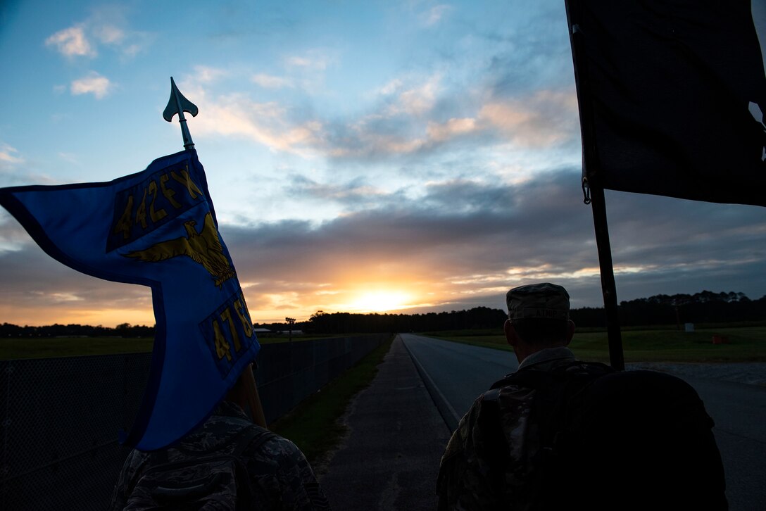 Airmen from the 476th Fighter Group participate in the POW/MIA Recognition Day ruck march Sept. 20, 2019, at Moody Air Force Base, Ga. In 1979, the United States Congress passed a resolution authorizing National POW/MIA Recognition Day to be observed together with the national effort of bringing isolated personnel home. The 347th Operations Support Squadron hosted the 24-hour ruck march to pay tribute to those who’ve been captured or missing in the line of duty. (U.S. Air Force photo by Senior Airman Erick Requadt)