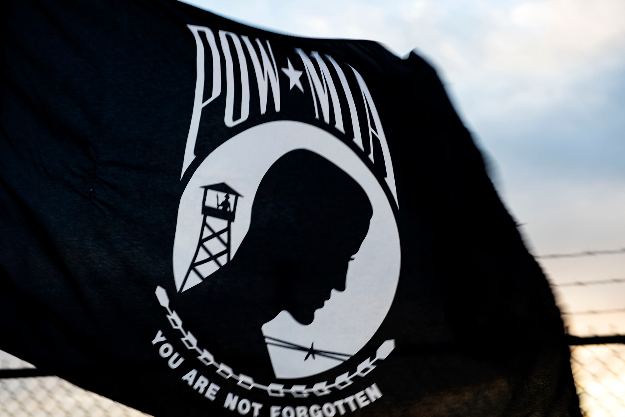 A POW/MIA flag blows in the wind during the POW/MIA Recognition Day ruck march Sept. 20, 2019, at Moody Air Force Base, Ga. The 347th Operations Support Squadron hosted the 24-hour ruck march to pay tribute to those who’ve been captured or missing in the line of duty. (U.S. Air Force photo by Senior Airman Erick Requadt)