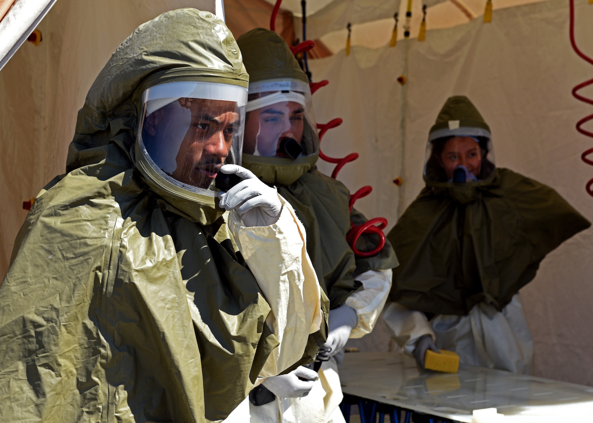 Personnel from the 17th Medical Group receive instructions during their medical in-place decontamination training at the Ross Clinic on Goodfellow Air Force Base, Texas, September 12, 2019. Personnel train on how to properly don their protective gear and how to communicate to disinfect their patients. (U.S. Air Force photo by Airman 1st Class Robyn Hunsinger/Released)