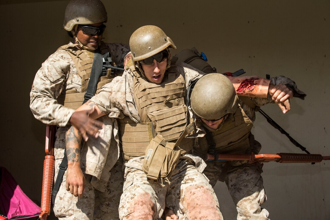 U.S. Navy Petty Officer 3rd Class Idelia Brandflu, left, and Seaman Sam Applin, right, both students with Field Medical Training Battalion - West, assess a simulated casualty as part of the Field Medical Service Technician Course final exercise at the FMTB training site on Marine Corps Base Camp Pendleton, California, Sept. 16, 2019. The final exercise is the last task the sailors must complete before earning the title of Fleet Marine Force corpsman. The staff and instructors at FMTB-West are responsible for training the corpsman and officers who provide medical support to Marine Corps units. Brandflu is a native of Murrieta, California. Applin is a native of Hanford, California.  (U.S. Marine Corps photo by Lance Cpl. Drake Nickels)