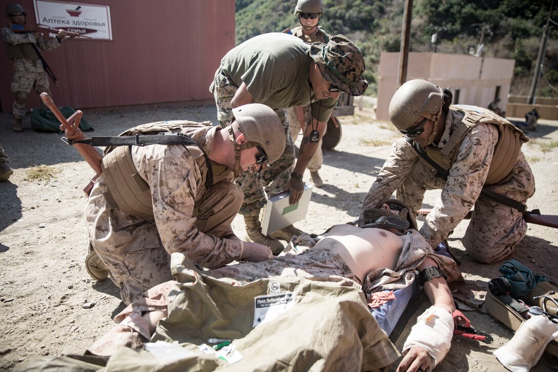 U.S. Navy sailors with Field Medical Training Battalion - West assess a simulated casualty as part of the Field Medical Service Technician Course final exercise at the FMTB training site on Marine Corps Base Camp Pendleton, California, Sept. 16, 2019. The final exercise is the last task the sailors must complete before earning the title of Fleet Marine Force corpsman. The staff and instructors at FMTB-West are responsible for training the corpsman and officers who provide medical support to Marine Corps units. (U.S. Marine Corps photo by Lance Cpl. Drake Nickels)