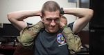 Maj. Joanna Borawski, 359th Medical Operations Squadron physical therapist, stretches Capt. Luke Seaman, 435th Fighter Training Squadron instructor pilot, during a consultation Aug. 8, 2019 at Joint Base San Antonio-Randolph, Texas. Borawski and her team at the physical therapy clinic have been scrubbing family health physicians' calendars looking for patients who can be seen directly by her.