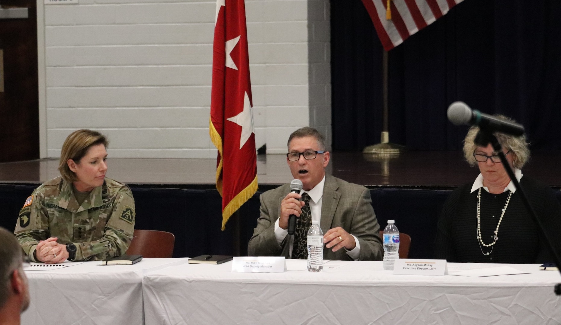 Mike Mathews (center), Army Support Activity deputy manager, updates residents on changes his office has made to provide better oversight of the privatized housing contractor at Joint base San Antonio-Fort Sam Houston during a town hall Sept. 18.