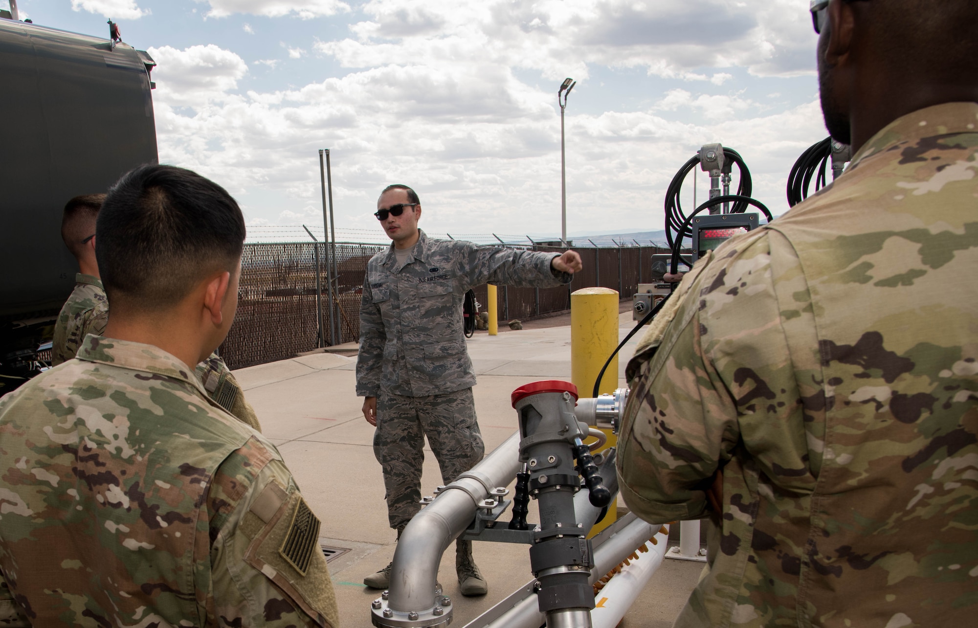 An Air Force Reservists speaks with Army Soldiers from Fort Carson at Peterson Air Force Base, Colorado, September 6, 2019.