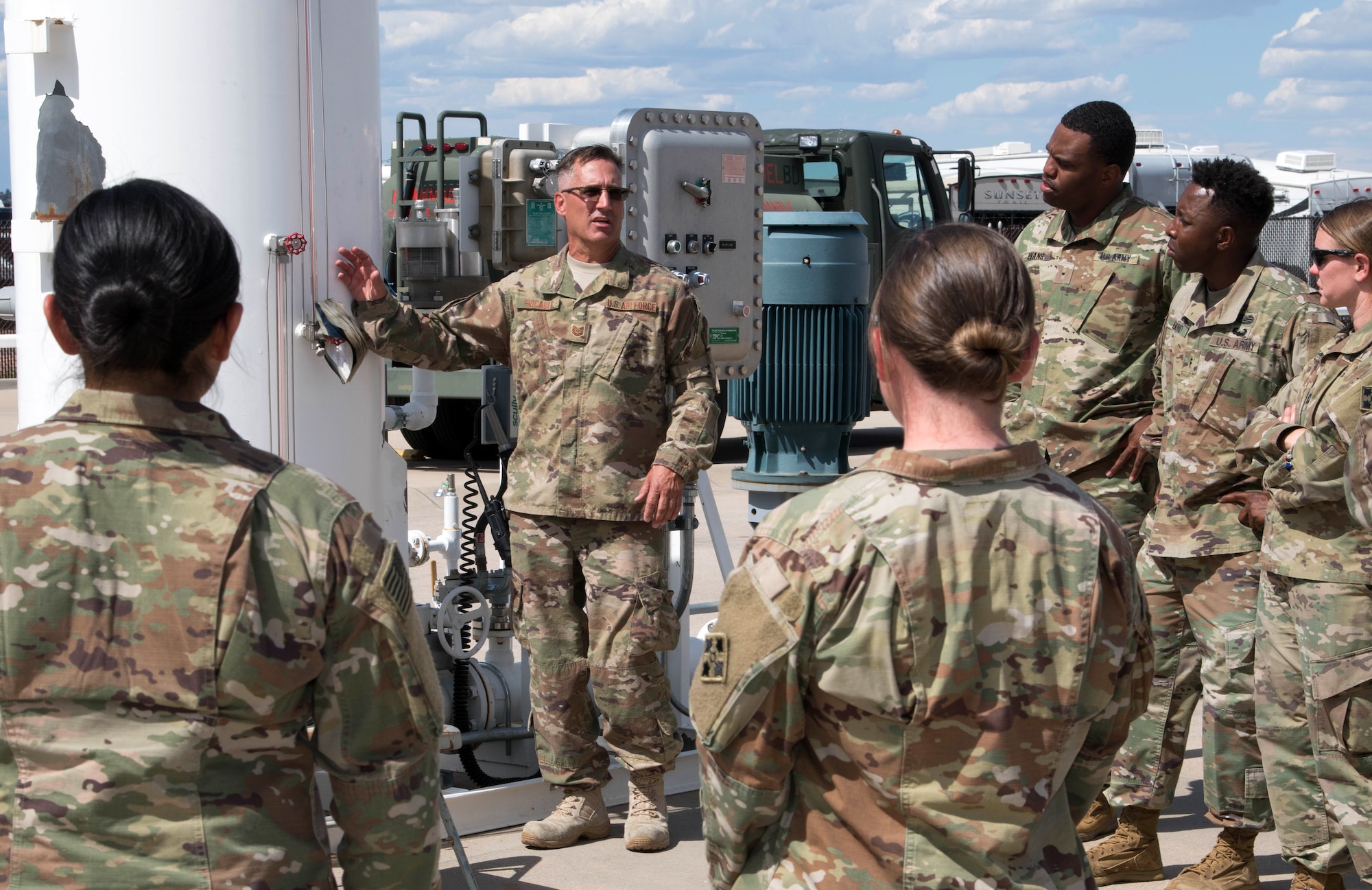 An Air Force Reservists speaks with Army Soldiers from Fort Carson at Peterson Air Force Base, Colorado, September 6, 2019.