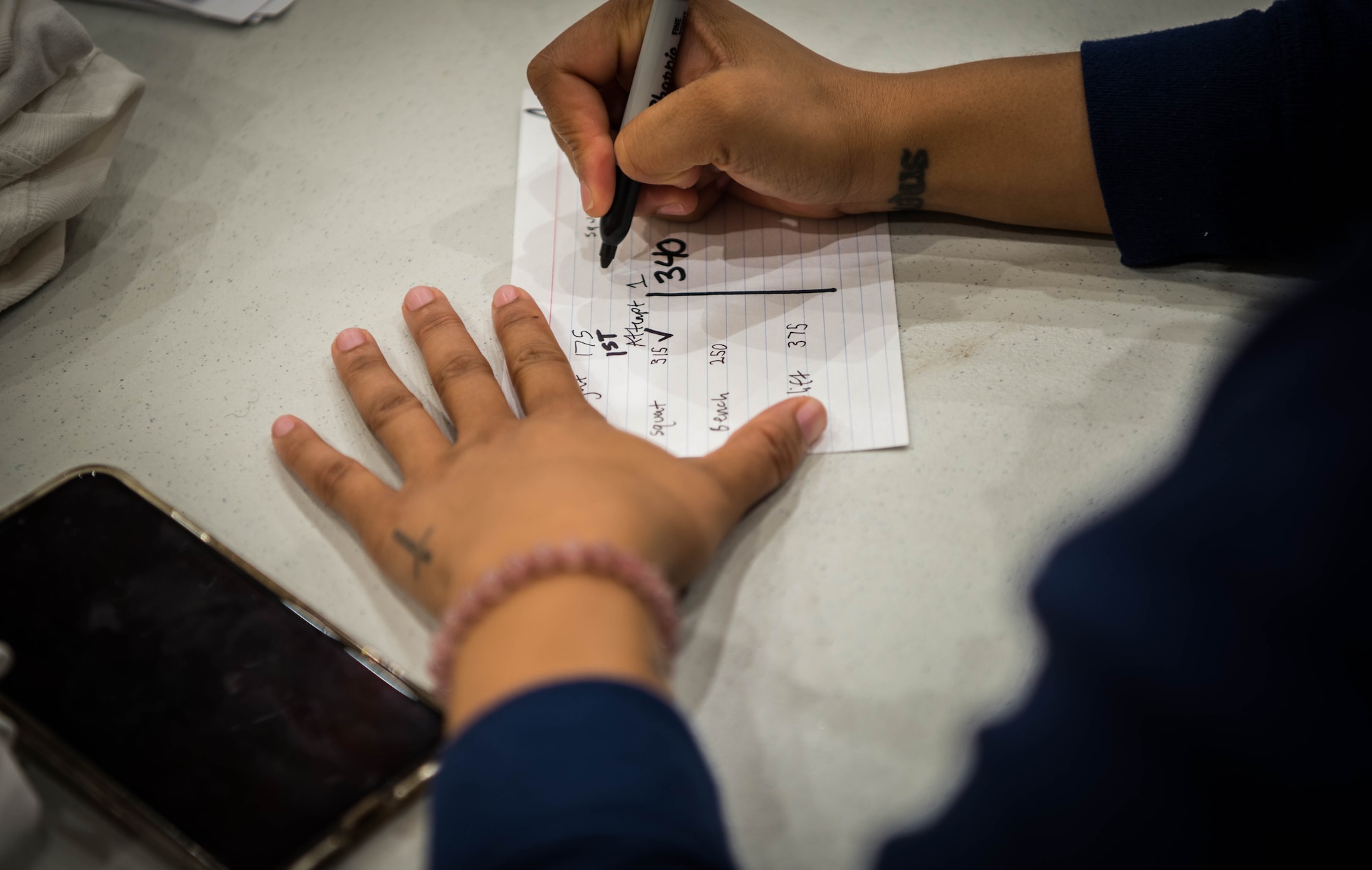 Woman fills out score card