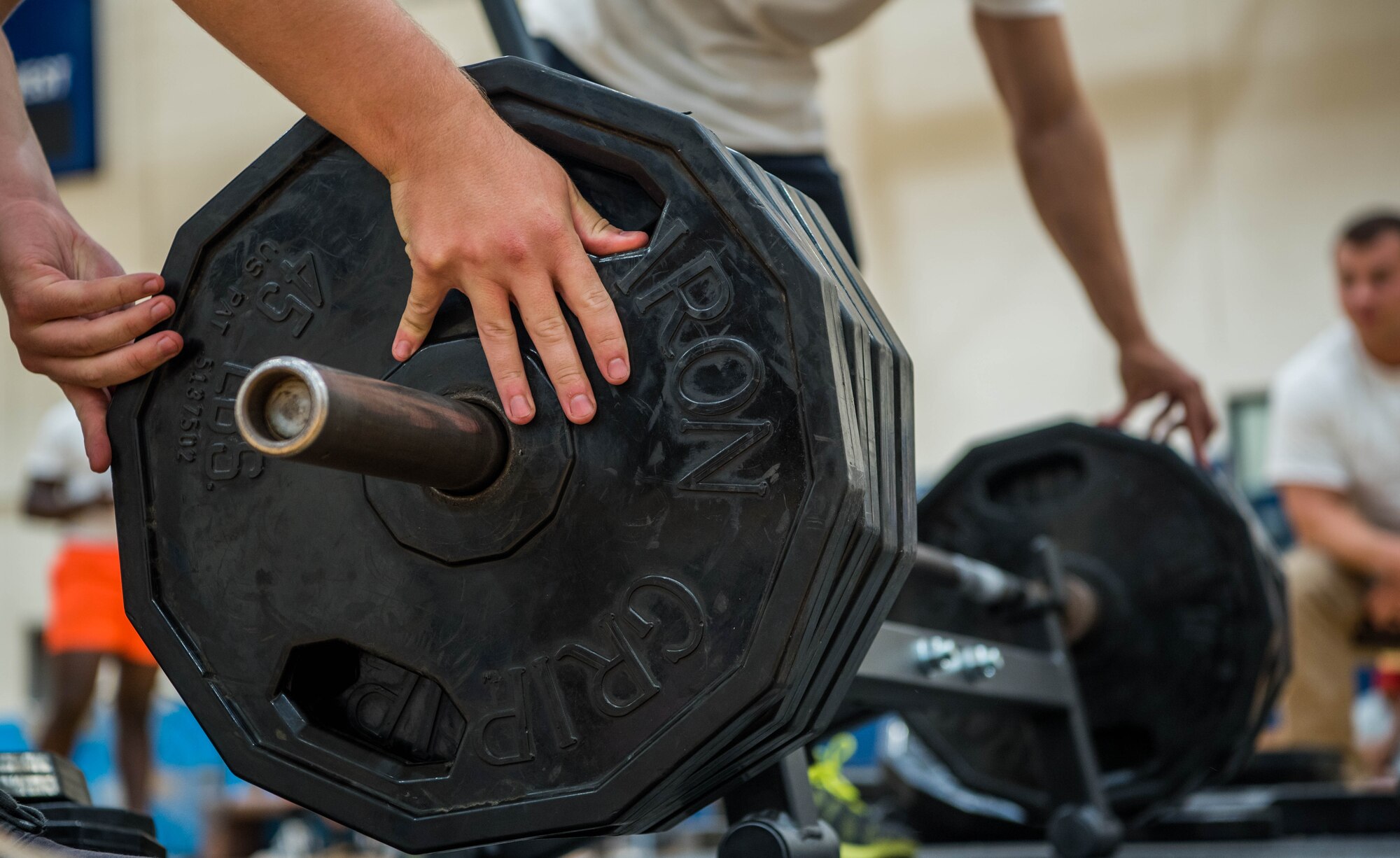volunteers prep weights for competition