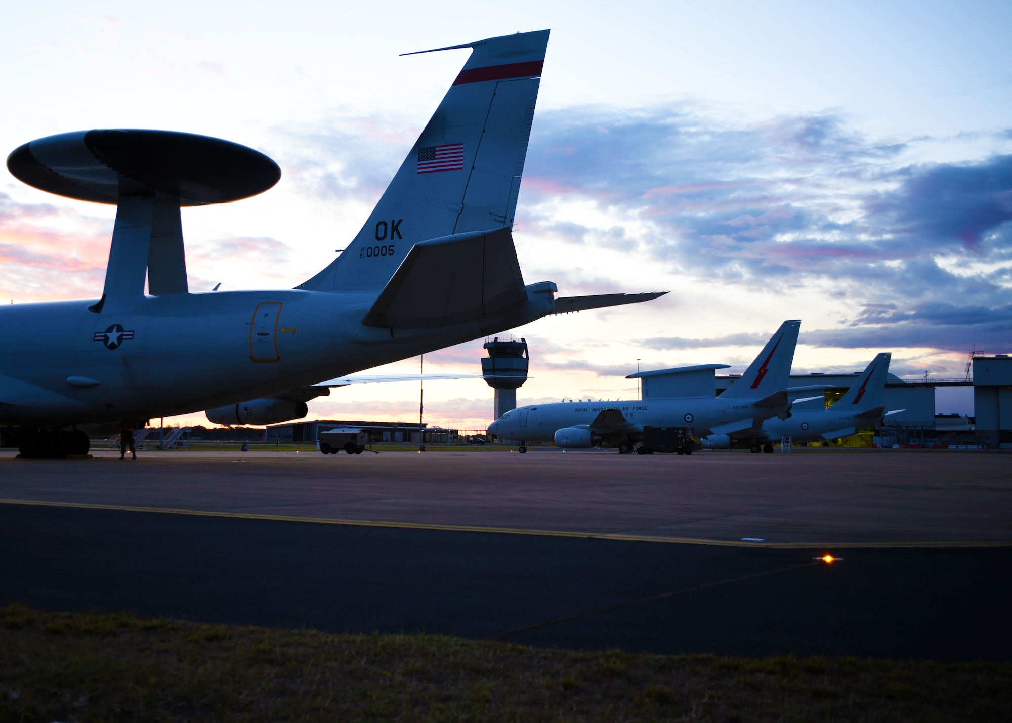 An E-3G Airborne Warning and Control System aircraft of the 552nd Air Control Wing, 960th Airborne Air Control Squadron, joins the Royal Australian Air Force E-7A Airborne Early Warning and Control aircraft in September 2019, Williamtown, Australia. The AWACS joined the RAAF to work on mission integration and partnership of similar airframes in response to the E-7A AEWC visiting the 552nd ACW in 2017. (U.S. Air Force photo/2d Lt Ashlyn K. Paulson)