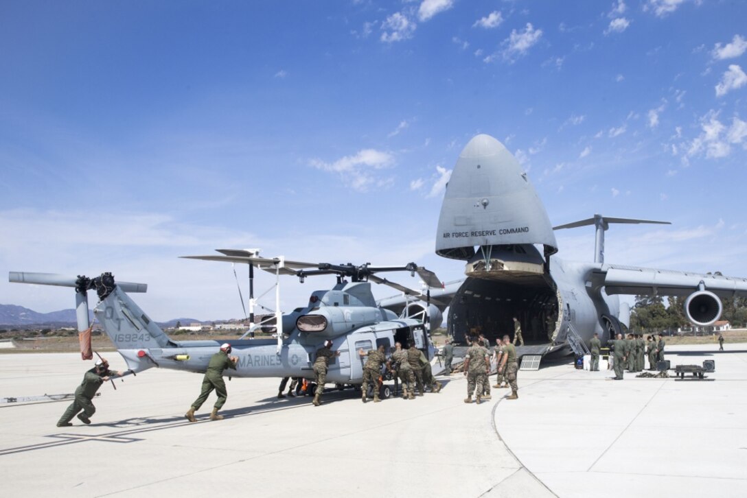 Venom UH-1Y being loaded into the C-5M Super Galaxy through sheer teamwork