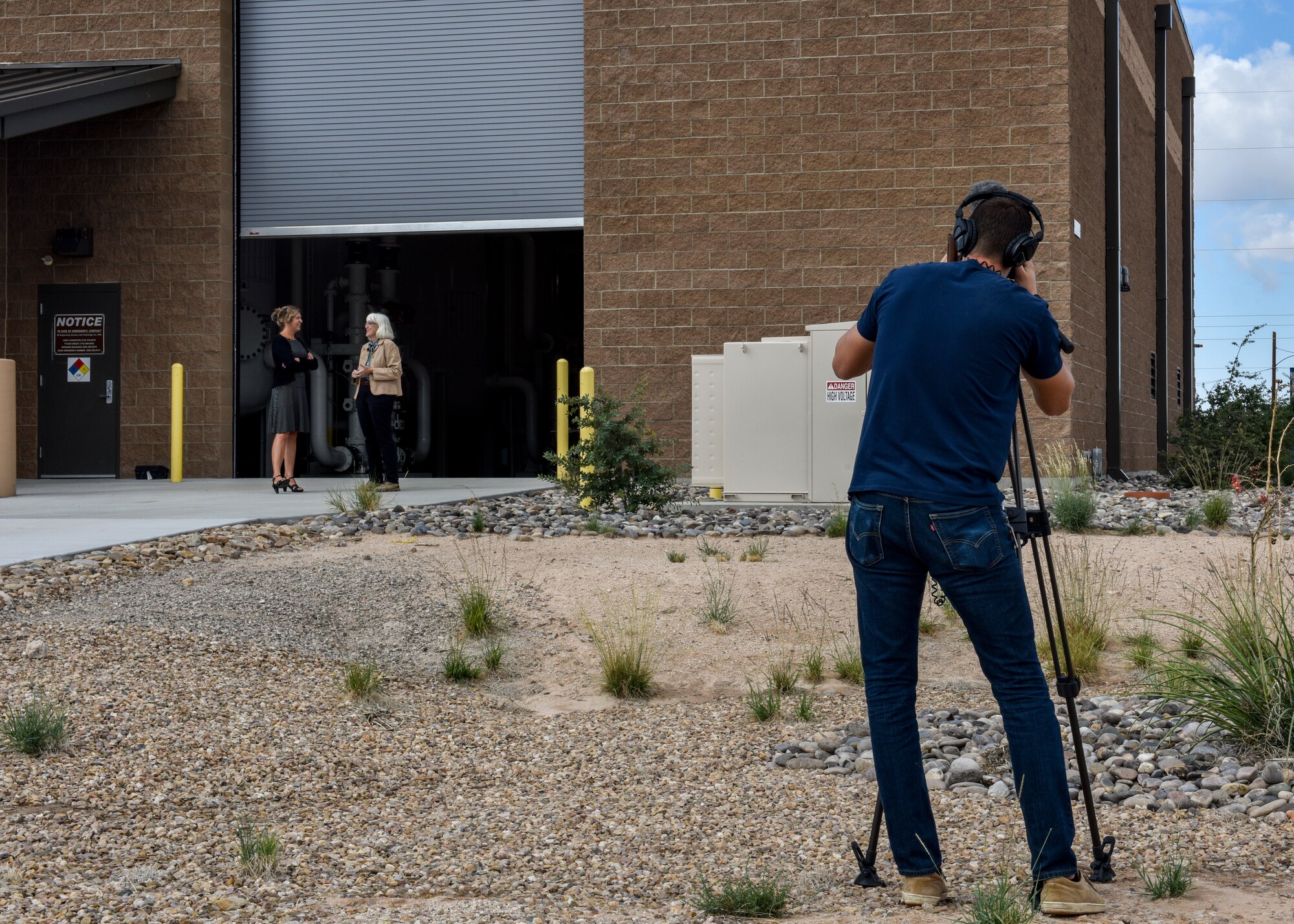 Antony Lostetter (right), New Mexico Public Broadcasting Service production manager, films an interview at Kirtland Air Force Base, N.M., Sept. 16, 2019. PBS filmed a news story at Kirtland’s groundwater treatment facility concerning what has been done to clean up the fuel spill. (U.S. Air Force photo by Airman 1st Class Austin J. Prisbrey)
