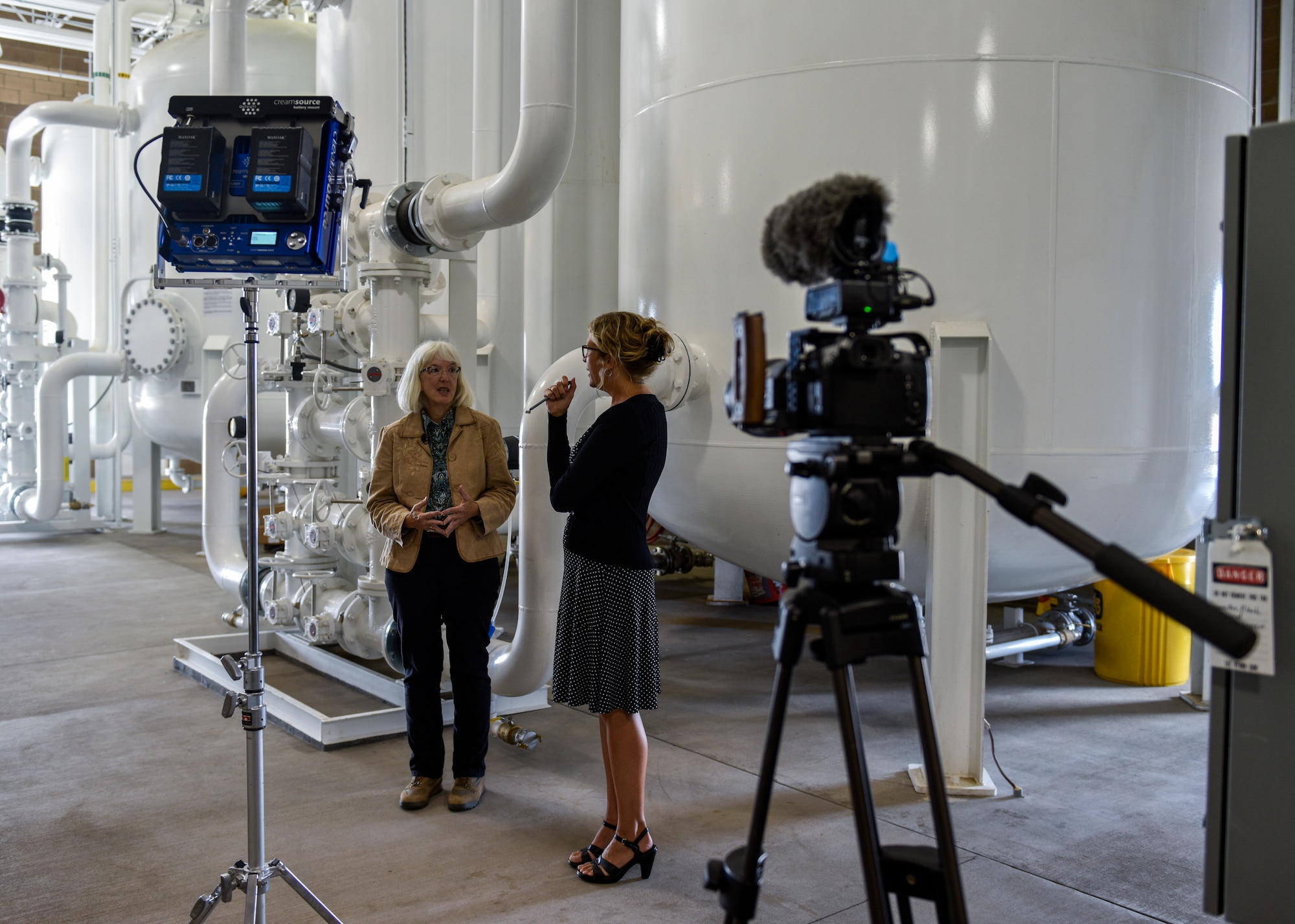 Kathryn Lynnes (left), Bulk Fuels Facility senior program manager, prepares for an interview with Laura Paskus (right), New Mexico Public Broadcasting Service correspondent, at Kirtland Air Force Base, N.M., Sept. 16, 2019. PBS filmed a news story at Kirtland’s groundwater treatment facility concerning what has been done to clean up the fuel spill. (U.S. Air Force photo by Airman 1st Class Austin J. Prisbrey)
