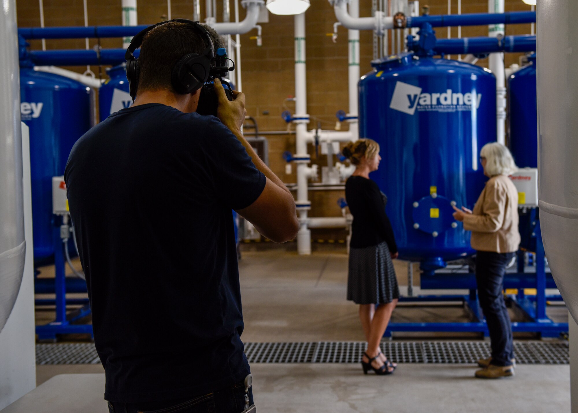 Antony Lostetter (left), New Mexico Public Broadcasting Service production manager, films an interview at Kirtland Air Force Base, N.M., Sept. 16, 2019. PBS filmed a news story at Kirtland’s groundwater treatment facility concerning what has been done to clean up the fuel spill. (U.S. Air Force photo by Airman 1st Class Austin J. Prisbrey)