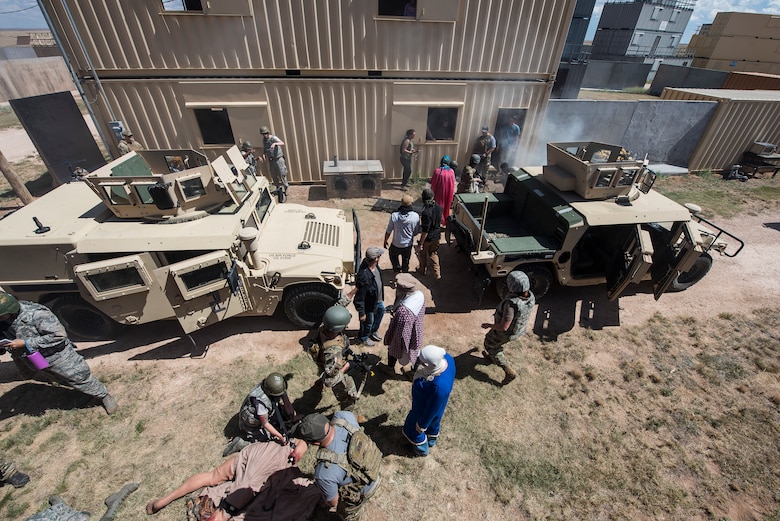 Participants of the Cannon Air Force Base Medic Rodeo carry out a scenario at Melrose Air Force Range, N.M., Sept. 18, 2019. The Medic Rodeo is designed to test the skills of Air Force medical technicians in both deployed and home instillation environments. (U.S. Air Force photo by Senior Airman Vernon R. Walter III)