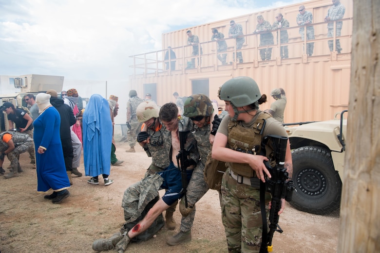 Two medical personnel from MacDill Air Force Base, Fla., carry a mock wounded military member during a scenario at the 2019 Medic Rodeo at Melrose Air Force Range, N.M., Sept. 19, 2019. A total of 19 medical teams from around the world competed in the rodeo, which is designed to test and improve their skills in both deployed and home installation environments. (U.S. Air Force photo by Staff Sgt. Michael Washburn)