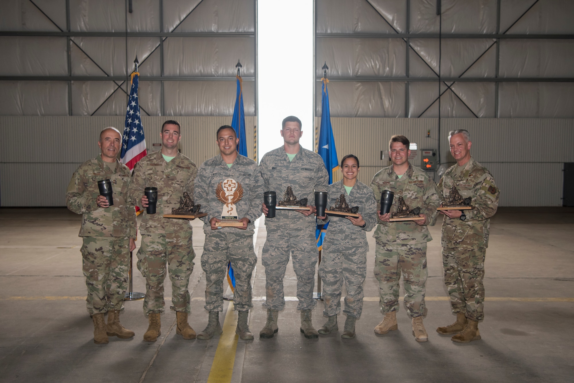 Medical technicians from Hurlburt Field, Fla., hold their trophies after winning first place at the 2019 Medical Rodeo closing ceremonies at Cannon Air Force Base, N.M., Sept. 20, 2019. A total of 19 medical teams from around the world competed in the rodeo, which is designed to test and improve their skills in both deployed and home installation environments. (U.S. Air Force photo by Staff Sgt. Michael Washburn)