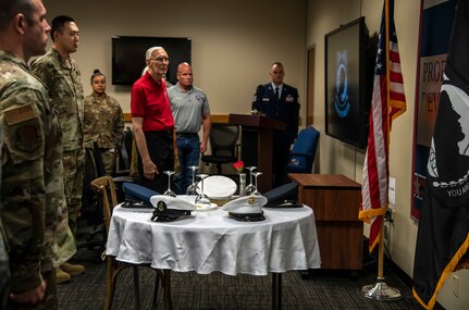 Joint Base San Antonio military and civilian community members stand during the playing of Taps during a POW/MIA Recognition Ceremony at JBSA-Lackland Kelly Field, Texas, Sept. 20, 2019. National POW/MIA Recognition Day is a day to remember more than 82,000 Americans remain missing from World War II, the Korean War, the Vietnam War, the Cold War, the Gulf War and other conflicts. Americans are asked to pause and reflect on the sacrifices made by the military men and women who are imprisoned or unaccounted for as a result of their military service and also reaffirming our promise never to relent in our quest to locate the Soldiers, Sailors, Marines, Airmen, Coast Guardsmen, Merchant Marines, and civilians who remain missing in action.