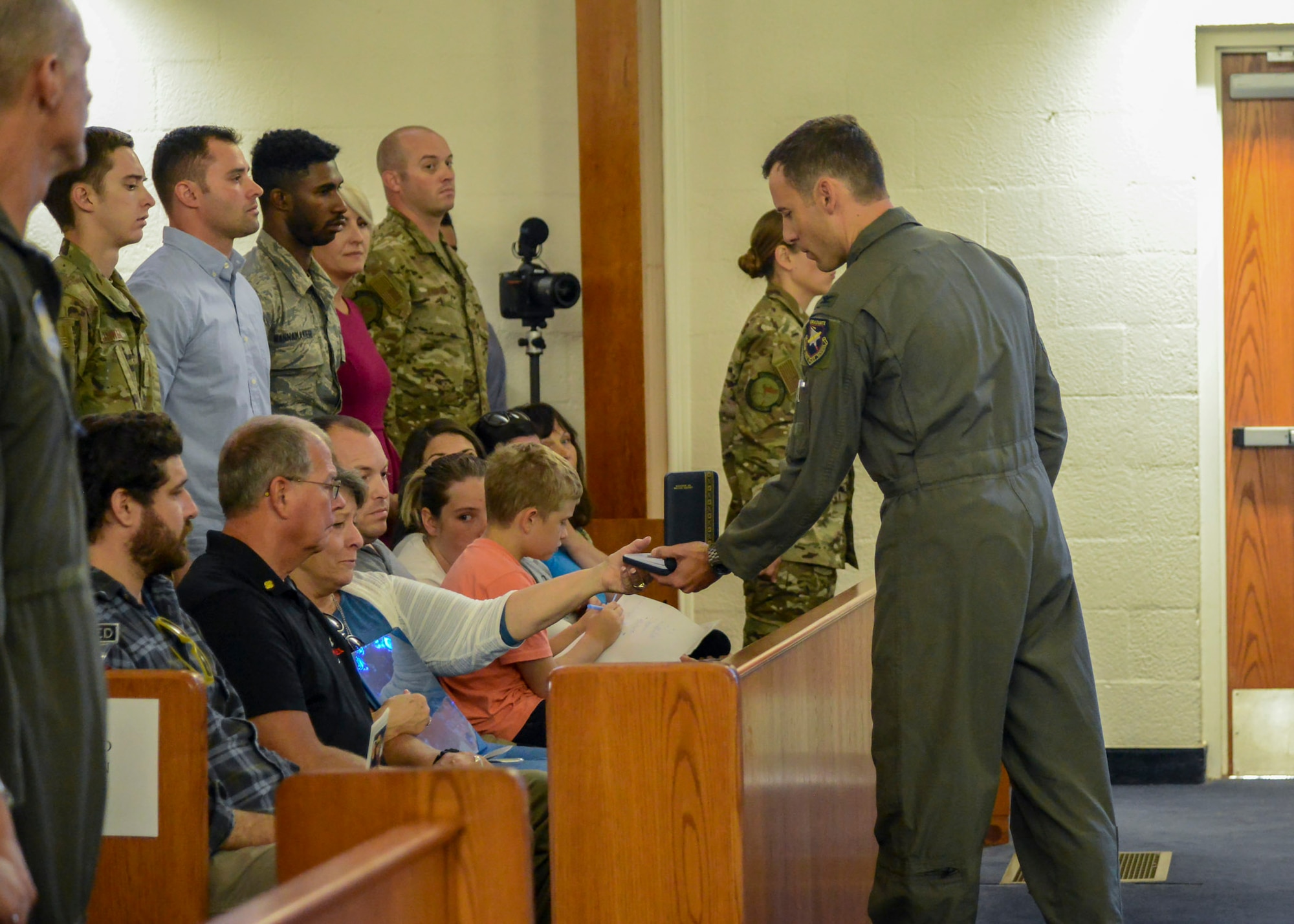 Col. Timothy Spaulding, 412th Operations Group Commander, presents Staff Sgt. Adam Erickson’s Meritorious Service Medal to his mother, Karen, during a memorial service in honor of Erickson at Edwards Air Force Base, California, Sept. 20. Erickson passed away, Sept. 10, during a training exercise. Erickson served with the 412th Operations Support Squadron as the noncommissioned officer-in-charge of Parachutist Program Operations. (U.S. Air Force photo by Giancarlo Casem)