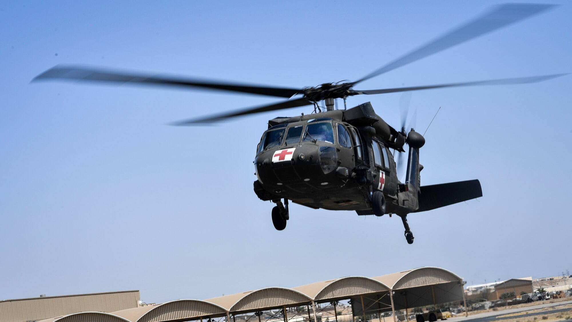 A UH-60 Black Hawk helicopter takes off during a medical evacuation exercise at Ali Al Salem Air Base, Kuwait, Sept. 13, 2019. Phase three of the exercise involved military working dog teams and emergency medical responders taking a familiarization ride around the base. The ride was an opportunity for handlers and medical personnel to see how MWDs reacted to the change in their environment. (U.S. Air Force photo by Staff Sgt. Mozer O. Da Cunha)