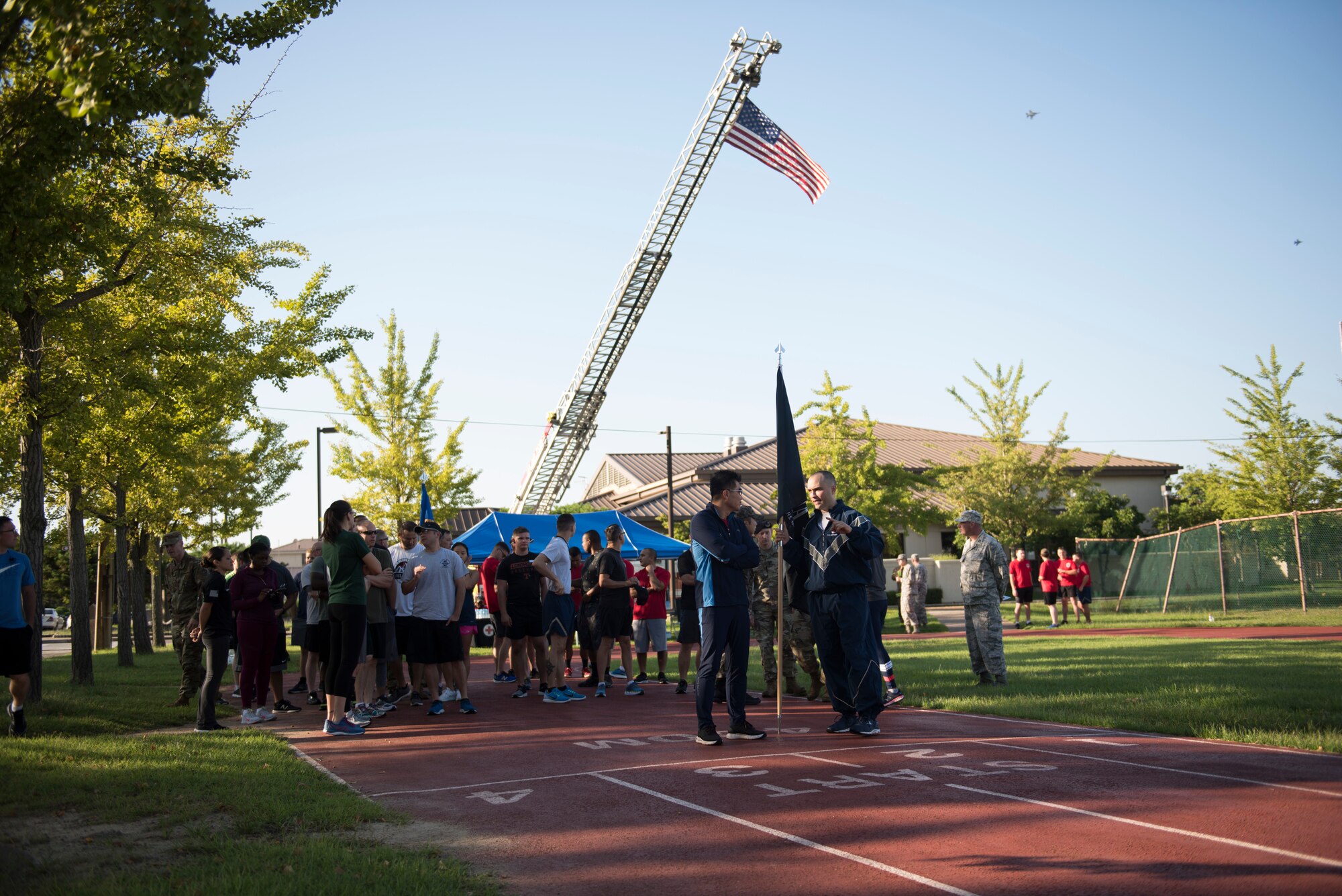 U.S. Air Force Col. Lawrence Sullivan (center right), 8th Fighter Wing vice commander, talks with Republic of Korea Air Force’s 38th Fighter Group leadership before a 24-hour prisoners of war and missing in action memorial run at Kunsan Air Base, Republic of Korea, Sept. 19, 2019. The Wolf Pack dedicated the week in honor of POW/MIA that consisted of several events for the base to participate in. (U.S. Air Force photo by Senior Airman Stefan Alvarez)