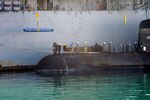 FREMANTLE, Australia (Sept. 13, 2019) - USS Emory S. Land (AS 39) transfers an inert training torpedo to the Australian Collins-class submarine HMAS Sheean (SSG 77) during a bilateral training event Sept. 13. Land is deployed to the U.S. 7th Fleet area of operations to support theater security cooperation efforts in the Indo-Pacific region.