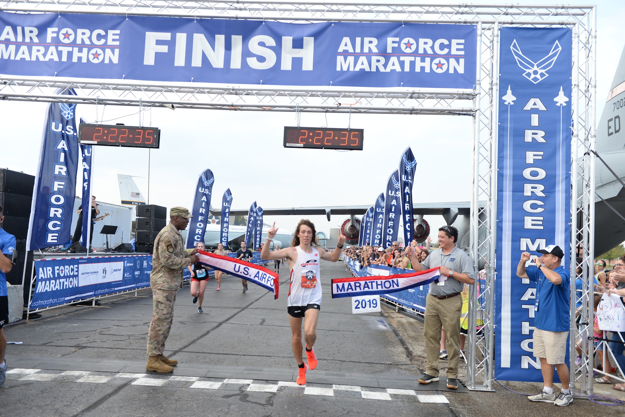 Juris Silenieks, Bath Township, Michigan, crosses the finish line winning the 2019 Air Force Marathon with a time of 2:22:37.  (Air Force photo by Wes Farnsworth)
