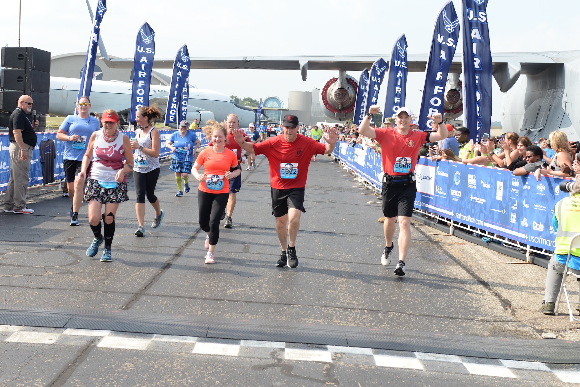 Gen. David L. Goldfein celebrates as he crosses the finish line at the 2019 Air Force Marathon at Wright-Patterson AFB, Ohio.(U.S. Air Force photo/Wesley Farnsworth)