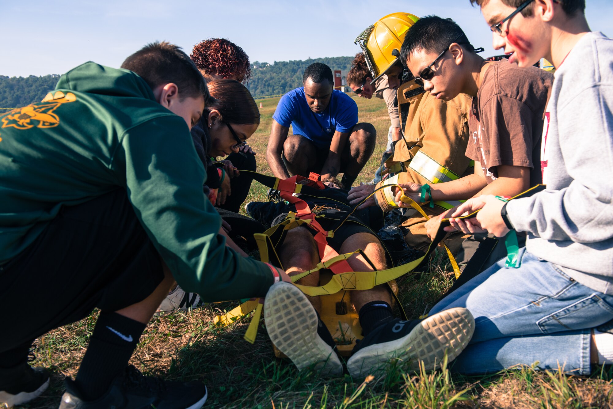 Members of the 193rd Special Operations Wing student flight and local volunteers help firefighters during a simulated aircraft crash during an exercise held at the September 21, 2019, at Harrisburg International Airport, in Middletown, Pennsylvania