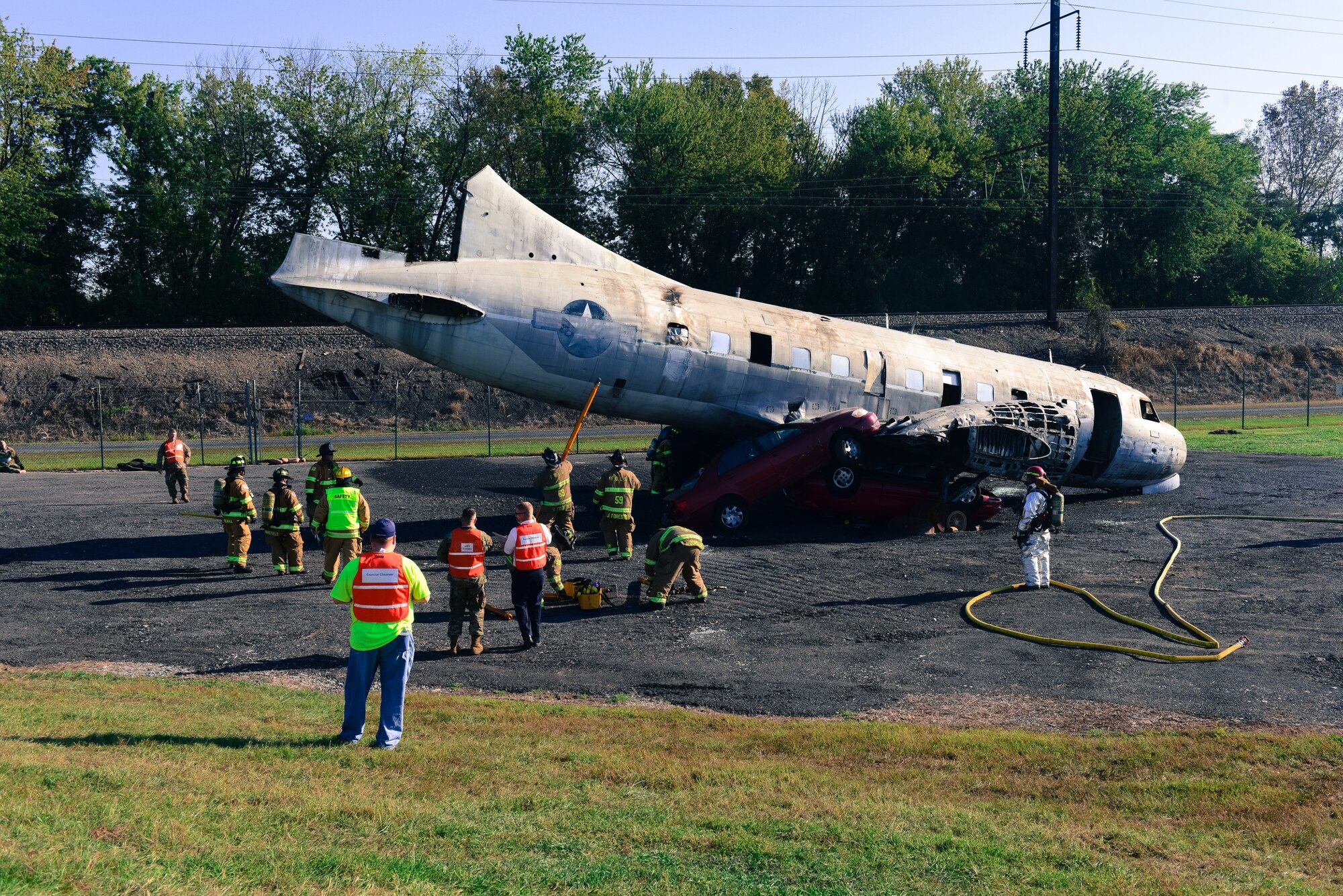 Firefighters from the 193rd Special Operations Civil Engineering Squadron, Cumberland, Dauphin, Lancaster and York counties participate in a simulated aircraft crash during an exercise held at the September 21, 2019, at Harrisburg International Airport, in Middletown, Pennsylvania.