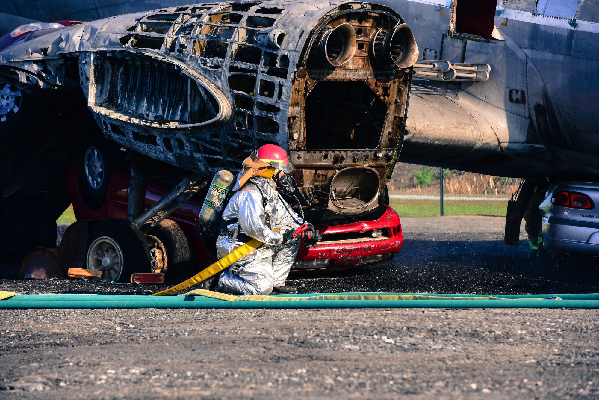 A firefighter crouches during a during a large-scale exercise September 21, 2019, at Harrisburg International Airport in Middletown, Pennsylvania.