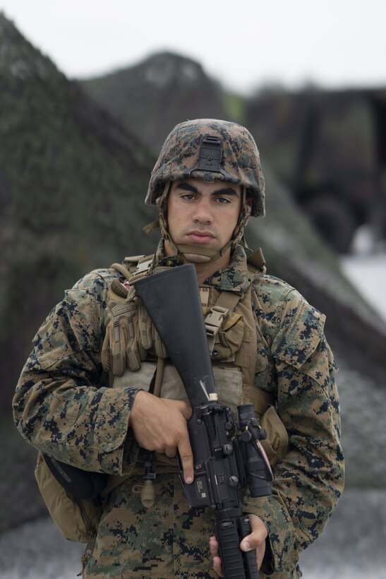 U.S. Marine Lance Cpl. Gabriel Marrero, a fire directional control specialist with Headquarters Battery, 12th Marine Regiment, 3rd Marine Division, stands security during Thunder Field Training Exercise on Camp Hansen, Okinawa, Japan, Sept. 18, 2019. The purpose of the exercise is to rehearse setting up an expeditionary combat operations center and refine procedures for doing so. Marrero is a native of Atlantic City, N.J. (U.S. Marine Corps photo by Pfc. Jamal Norris)