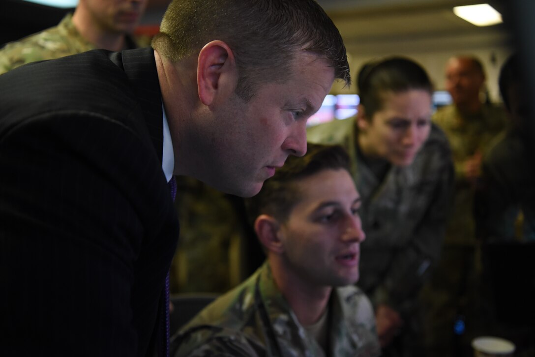 Ryan D. McCarthy, acting Secretary of the Army, speaks with Staff Sgt. Cody Daste, a coalition air liaison assigned to the 727th Expeditionary Air Control Squadron, Sept. 20, 2019, on Al Dhafra Air Base, United Arab Emirates.