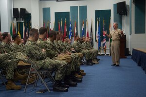 190919-N-IO414-1023 NAVAL SUPPORT ACTIVITY, Bahrain (September 19, 2019) Vice Adm. Richard Brown, commander, Naval Surface Forces (CNSF), addresses Sailors assigned to various commands in Bahrain during an all-hands call. While in the region, Brown discussed efforts to build combat ready ships and battle-minded crews while preparing for the high-end fight. (U.S. Navy photo by Mass Communication Specialist 2nd Class Jordan Crouch)