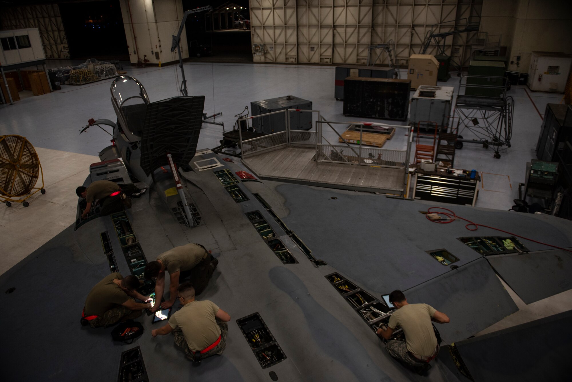 U.S. Airmen assigned to the 18th Equipment Maintenance Squadron inspect an F-15C Eagle during a phase inspection at Kadena Air Base, Japan, Sept. 17, 2019.