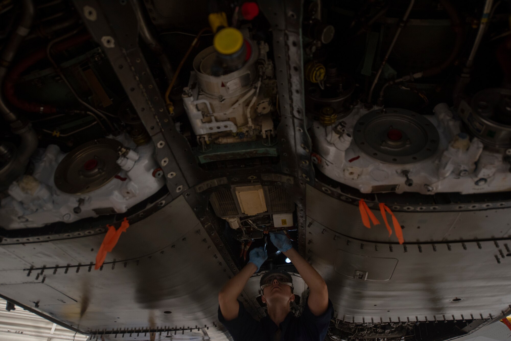 U.S. Air Force Airman Heidi Moon, 18th Equipment Maintenance Squadron phase inspector, installs a jet-fuel starter during a phase inspection at Kadena Air Base, Japan, Sept. 17, 2019.