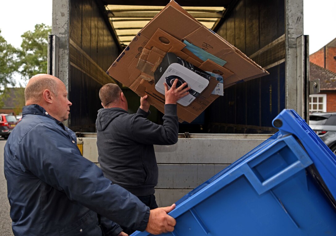 Members of the 100th Civil Engineer Squadron Recycling Center dispose of recyclable material in their 7.5 ton vehicle which is used for waste pick-up and providing external bins to facilities at RAF Mildenhall, England, Sept. 11, 2019. The recycling center provides external bins, labels, collect, transport and processes materials in the hopes of diverting waste from landfills. In fiscal year 2019, RAF Mildenhall is on pace to separate approximately 450 tons of waste for recycling which will generate about $40,000 for base projects. (U.S. Air Force photo by Airman 1st Class Brandon Esau)