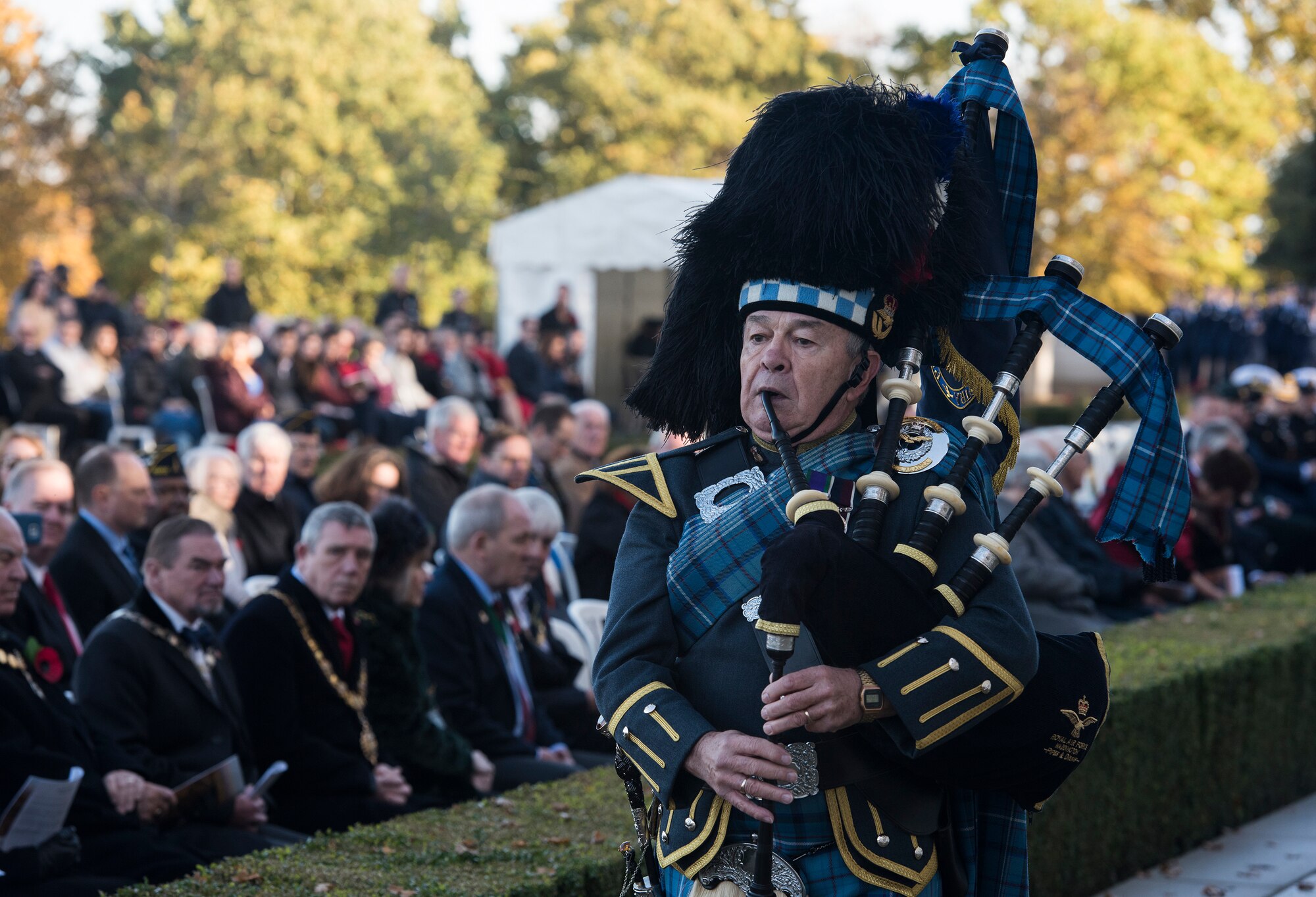 Royal Air Force Warrant Officer Gary Kernagham (Ret’d), performs Taps during a Veterans Day memorial event located at the Cambridge American Cemetery and Memorial, England on November 12, 2018. The ceremony marked 100 years since the first Armistice day on Nov. 11, 1918 when World War I came to an end. (U.S. Air Force photo by TSgt. Brian Kimball)