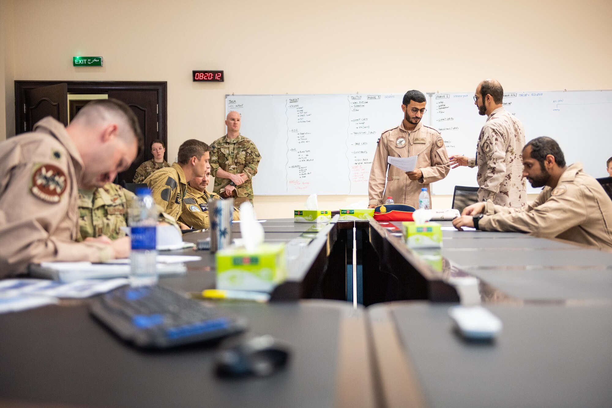 The Blue Team breaks into small groups during mission planning for a large force exercise Aug. 27, 2019, United Arab Emirates. The exercise brought French, Emirati and American forces together to build partnerships, tactical capabilities and interoperability with allies. (U.S. Air Force photo by Staff Sgt. Chris Thornbury)