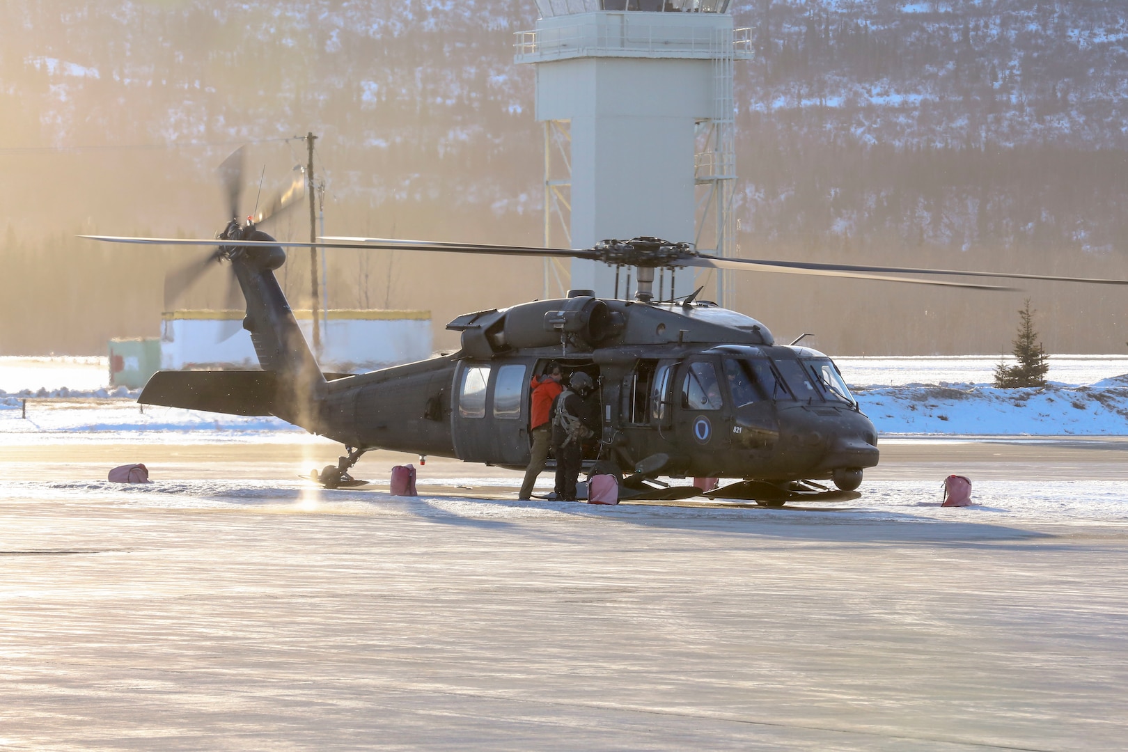 Alaska National Guardsmen launch from Bryant Army Airfield on Joint Base Elmendorf-Richardson, Alaska, via a 1st Battalion, 207th Aviation Regiment, UH-60 Black Hawk helicopter with two pararescuemen from the 212th Rescue Squadron, 176th Wing, and an Army critical care flight paramedic from Detachment 2, Golf Company, 2nd General Support Aviation Battalion, 104th Regiment, on board to conduct continued search-and-rescue operations for a missing aircraft in the vicinity of Rainy Pass, March 12, 2019.
