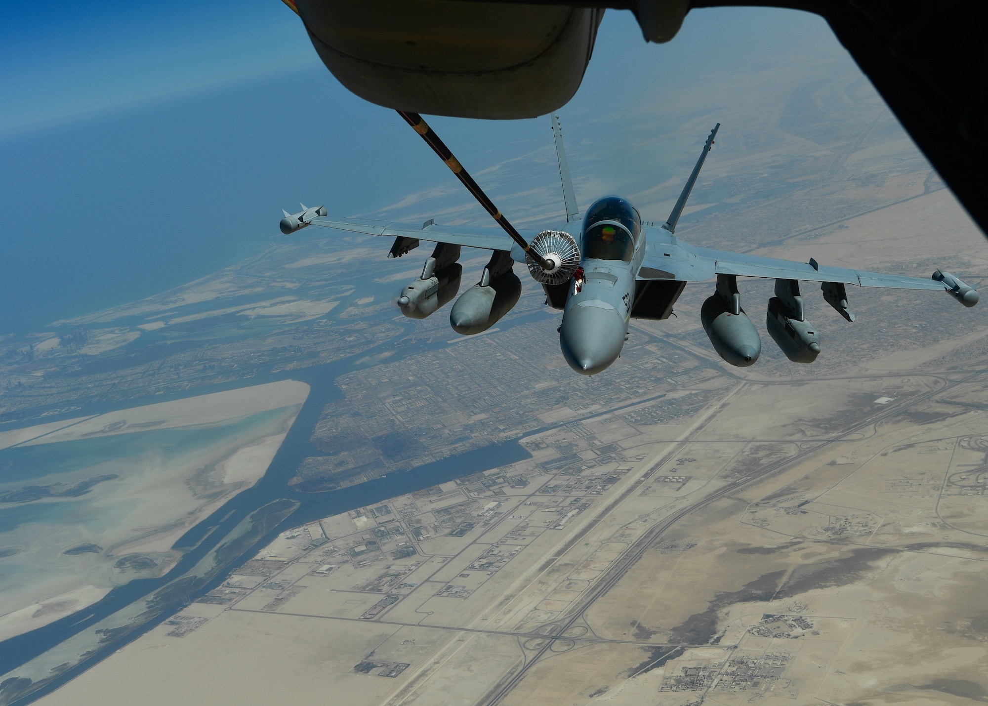 A U.S. Navy EA-18G Growler receives fuel from a KC-10 Extender assigned to the 908th Expeditionary Air Refueling Squadron out of Al Dhafra Air Base, United Arab Emirates, Aug. 28, 2019. The 908th EARS, part of U.S. Air Forces Central Command, is responsible for delivering fuel to U.S. and coalition forces, enabling a constant presence in the area of responsibility. (U.S. Air Force photo by Staff Sgt. Chris Drzazgowski)