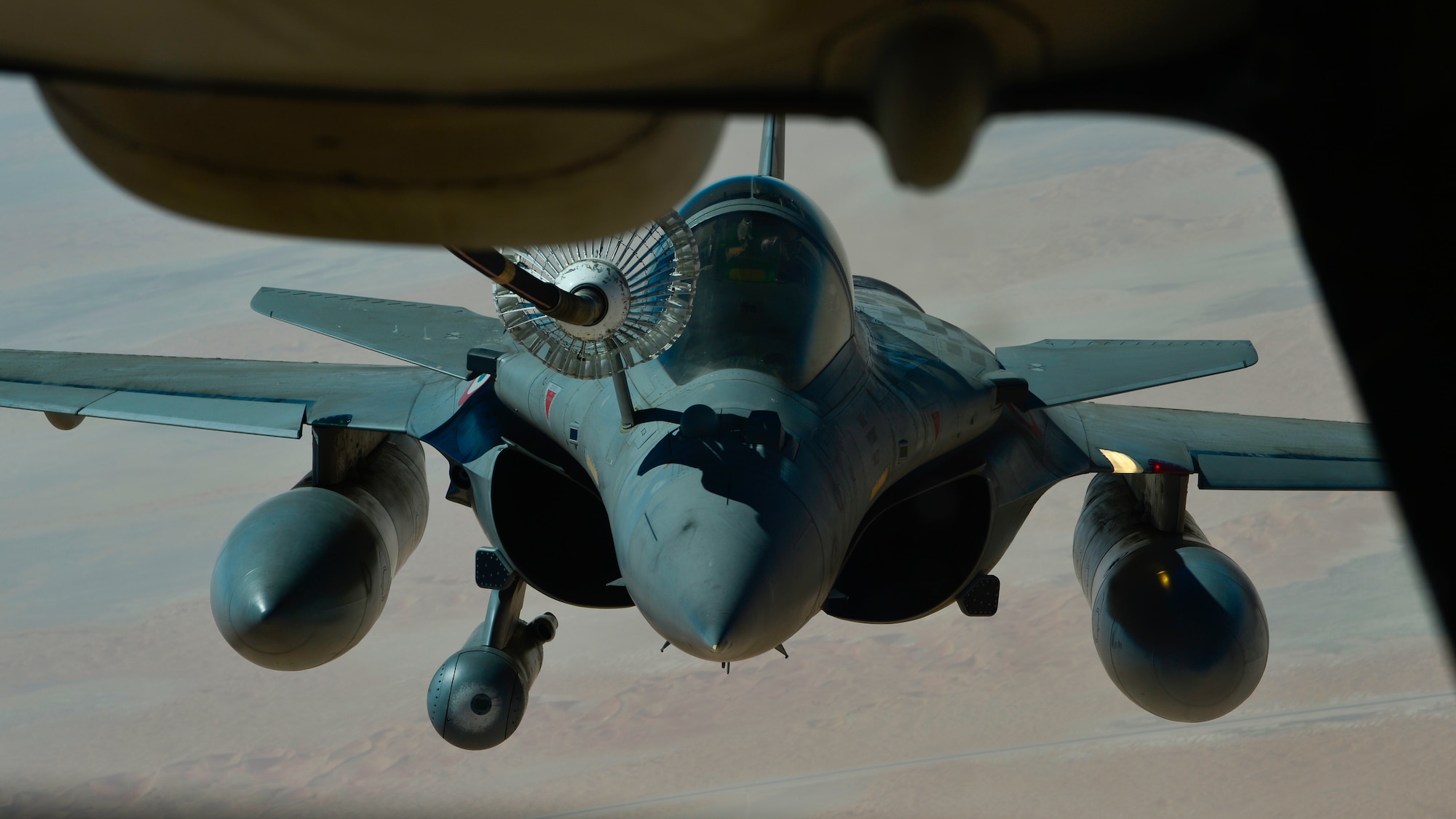 A French Air Force Dassault Rafale receives fuel from a U.S. Air Force KC-10 Extender assigned to the 908th Expeditionary Air Refueling Squadron out of Al Dhafra Air Base, United Arab Emirates, Aug. 28, 2019. Assets under U.S. Air Forces Central Command maintain a constant partnership with regional air forces to augment and perfect capabilities while striving for operational harmony. (U.S. Air Force photo by Staff Sgt. Chris Drzazgowski)