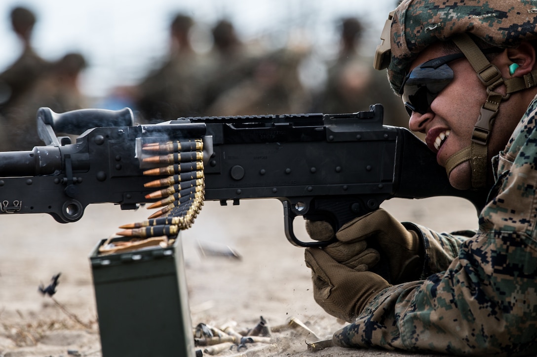 A U.S. Marine fires an M240 medium machine gun during an all arms familiarization range at Range 407 on Marine Corps Base Camp Pendleton, Sept. 19.