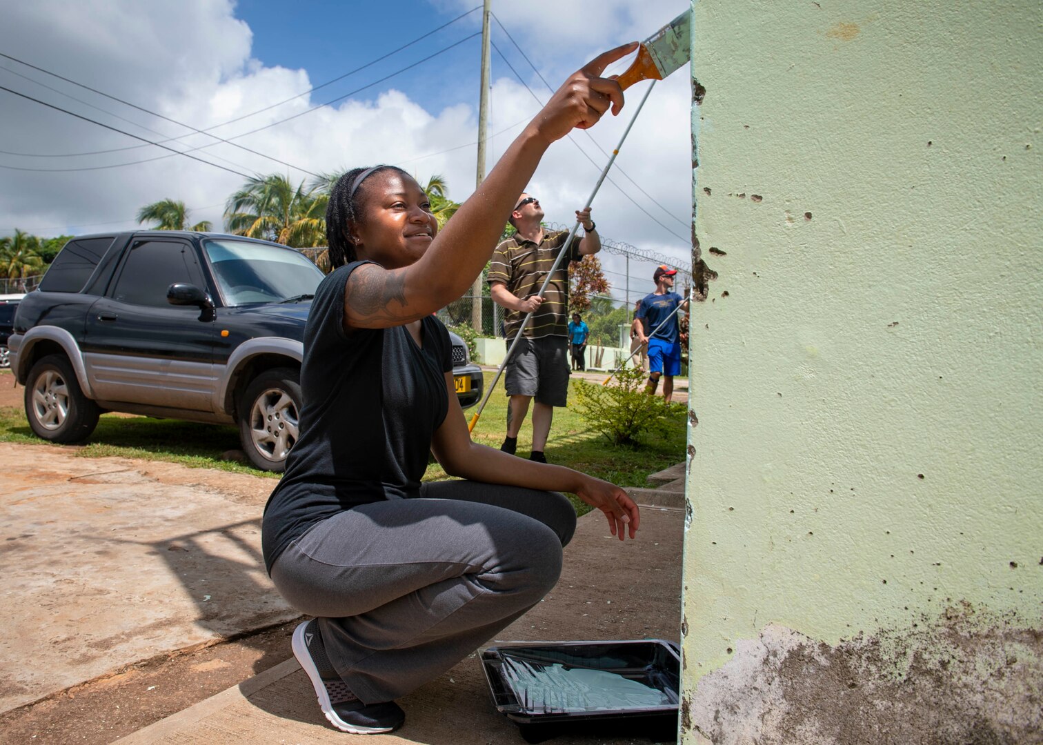 A woman aints a juvenile detention center in St. George's, Grenada.