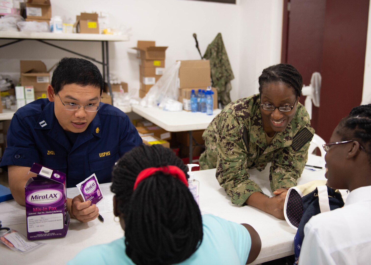 Pharmacists discuss medication with patients.