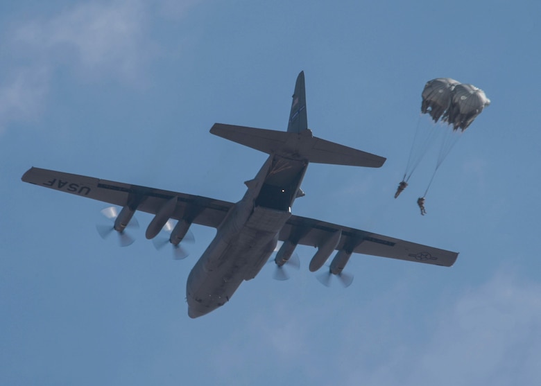 Two participants of Exercise Eager Lion do a static line jump from the ramp of a C-130H3 from Dobbins Air Reserve Base, Ga., during the Friendship Jump on Sept. 5, 2019 in Jordan.