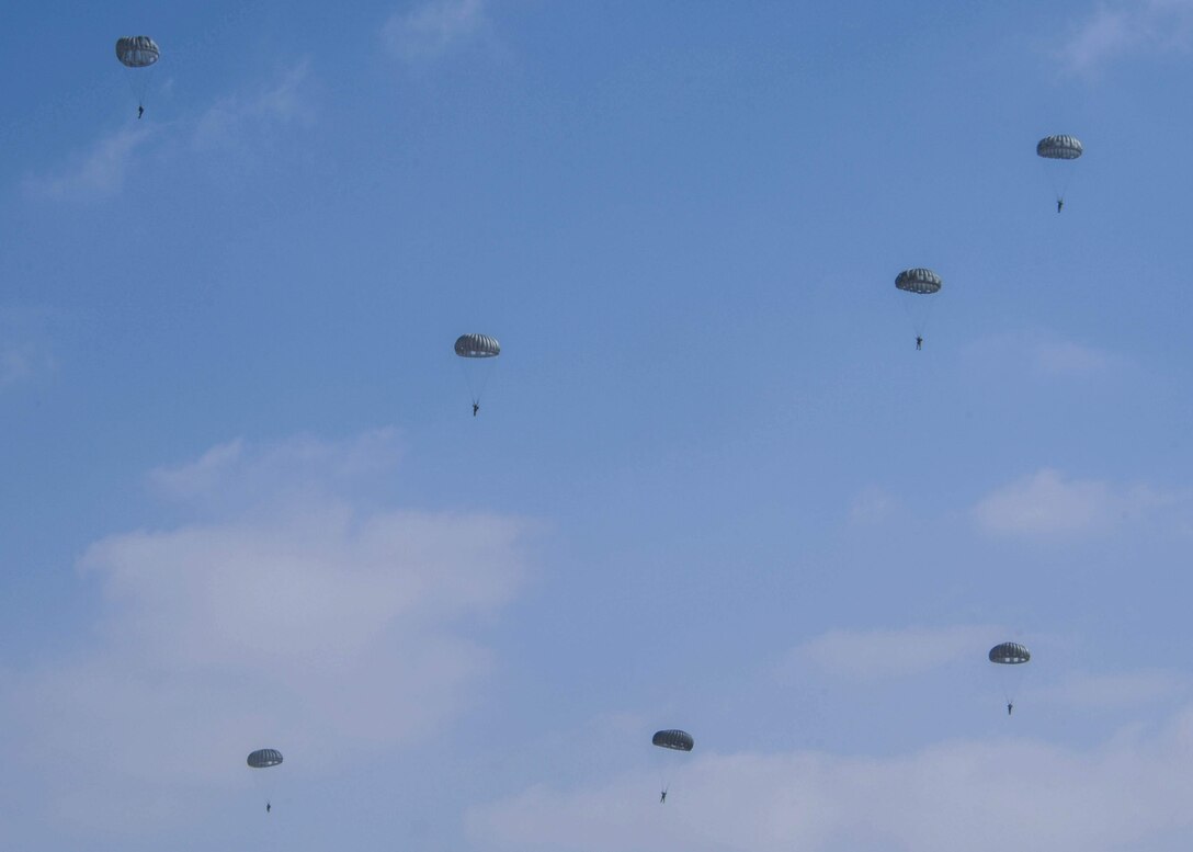 Participants of Exercise Eager Lion parachute down from a static line jump during the Friendship Jump on Sept. 5, 2019 in Jordan.