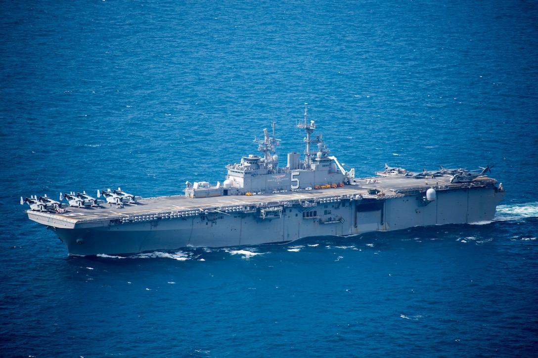 U.S. Navy amphibious assault ship USS Bataan (LHD 5) conducts a simulated strait transit during Amphibious Ready Group (ARG), Marine Expeditionary Unit (MEU) exercise (ARGMEUEX) in the vicinity of South Carolina, Aug. 30, 2019. Rehearsing strait transits help make the ARG/MEU team a more versatile, sea-based expeditionary force that can be tailored to a variety of missions. (U.S. Marine Corps photo by Cpl. Nathan Reyes)
