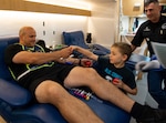 Jacob French, age 6, thanks Sgt. 1st Class Eduardo Perez for donating his blood during a blood drive Sept. 19 at the Military & Family Readiness Center that was hosted by the Joint Base San Antonio-Fort Sam Houston Exceptional Family Member Program and the Armed Services Blood Program.