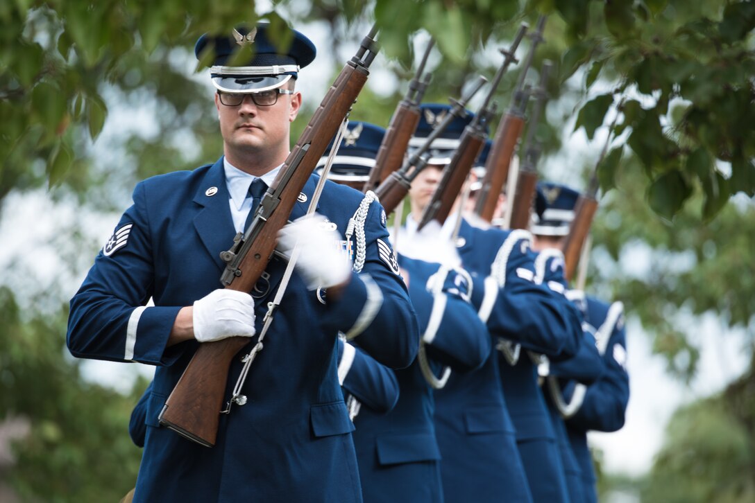 Staff Sgt. Daniel Patten, 22nd Force Support Squadron honor guardsmen, leads a formation during a 21-gun salute at the 2019 prisoner(s) of war/missing in action Retreat Ceremony Sept. 20, 2019, at McConnell Air Force Base, Kan. The three volleys, 21-gun salute, come from an old battlefield custom where after a ceasefire, the warring sides were notified that the injured and dead were properly cared for. It is now used as a ceremonial tradition during funerals. (U.S. Air Force photo by Senior Airman Alan Ricker)